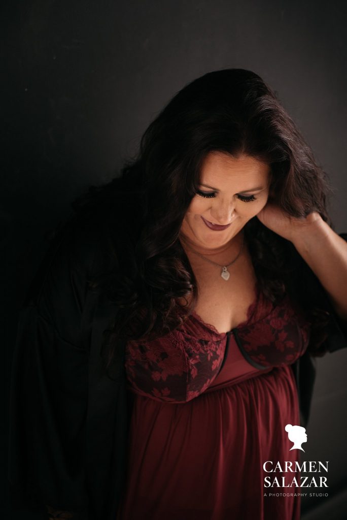 Show off your unique personality through boudoir photography, woman in red top