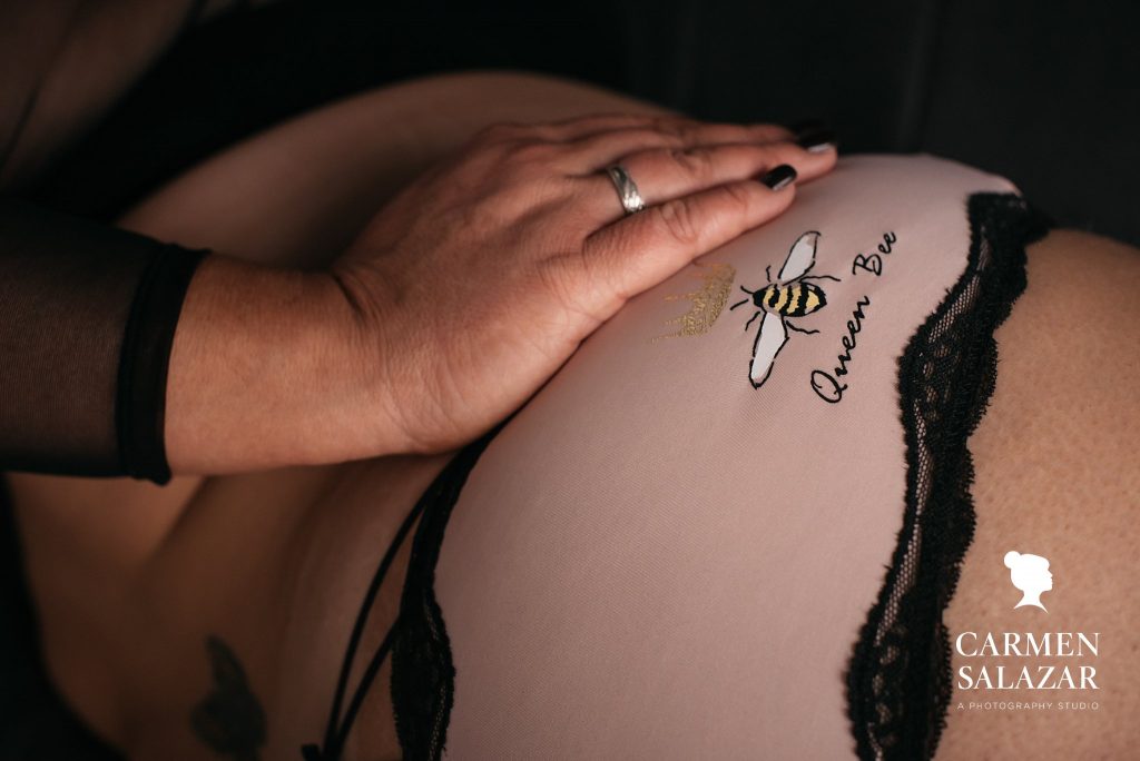 Show off your unique personality through boudoir photography by Carmen Salazar; woman with "Queen Bee" lingerie